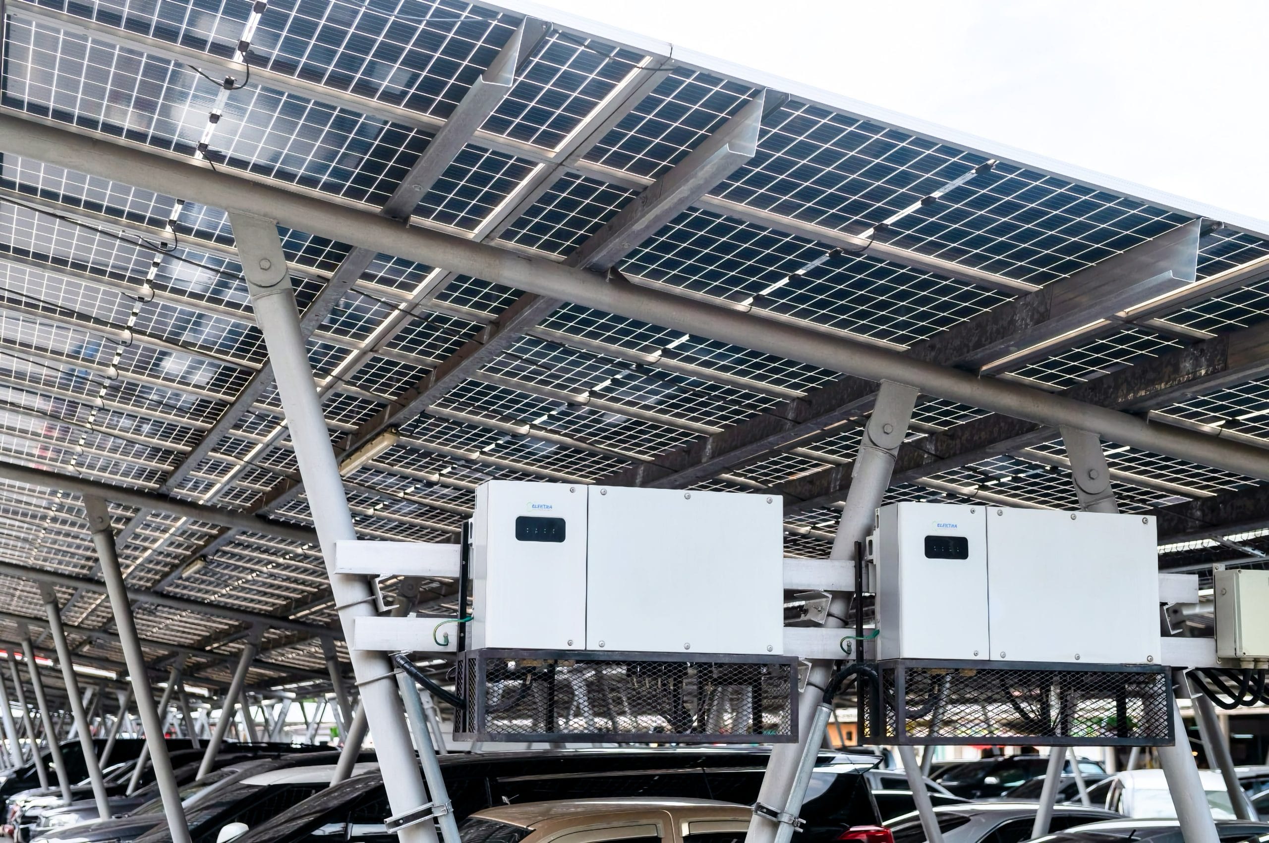 A solar array over a car park with the subject being electrical inverters installed by Elektra Technologies